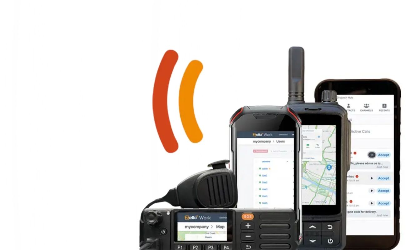 Conjunto de radios de uso rudo y un smartphone, mostrando la aplicación de comunicación PTT Zello, con un camión de carga de fondo borroso.